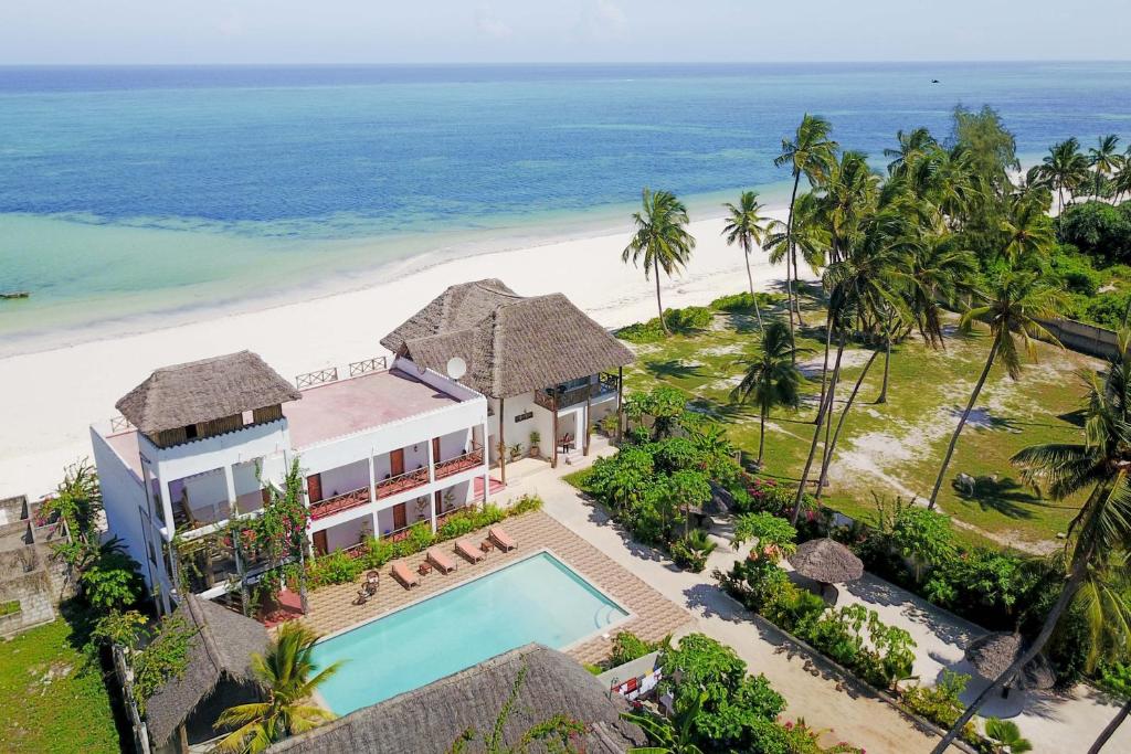 an aerial view of a resort with a swimming pool and the beach at Isla Bonita Zanzibar Beach Resort in Matemwe