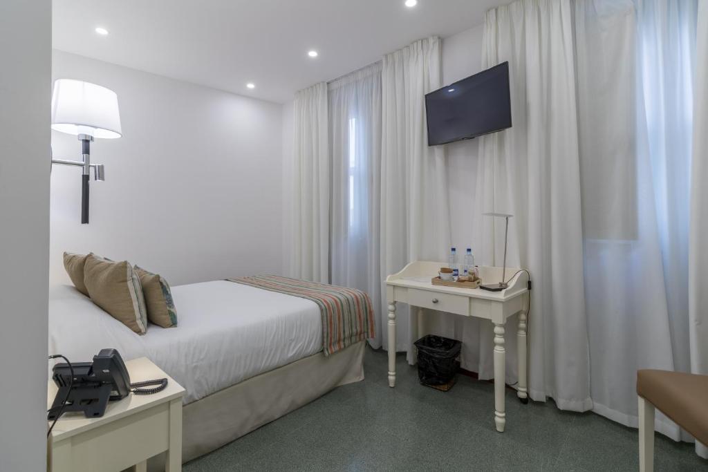 TV a/nebo společenská místnost v ubytování Hotel Emblemático Holiday Time