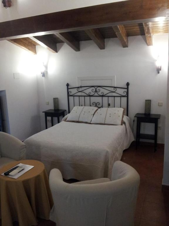 A bed or beds in a room at Posada Villa Maria