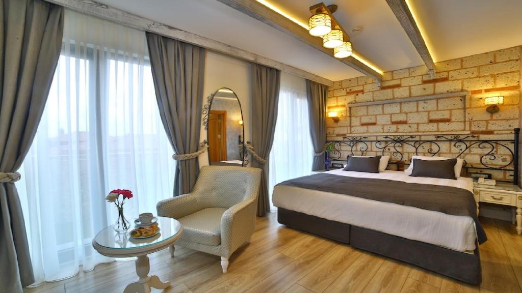 A bed or beds in a room at Yılsam Sultanahmet Hotel