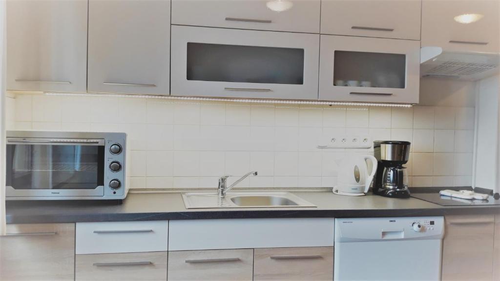 Kuchyň nebo kuchyňský kout v ubytování Apartment Ulrich