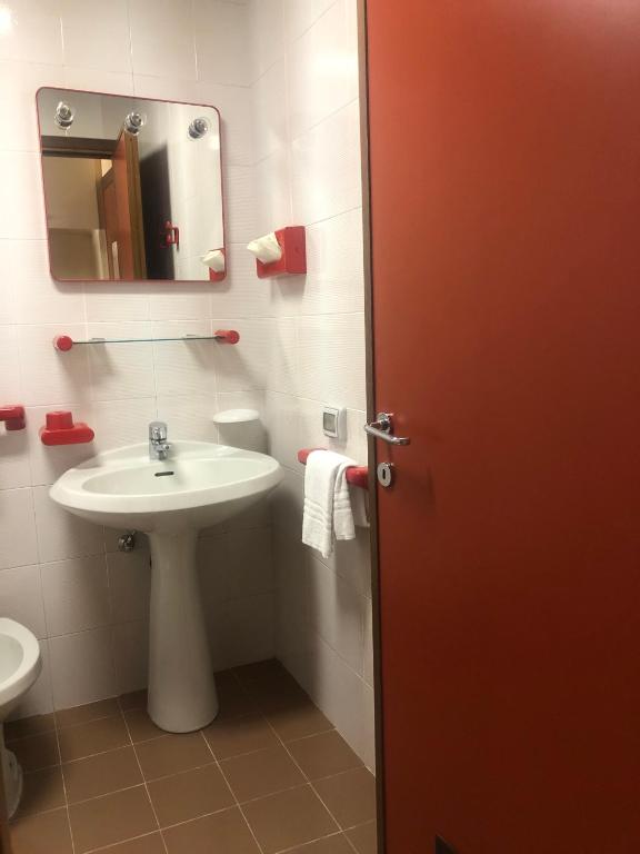 Koupelna v ubytování Albergo Casa dell'Ospite