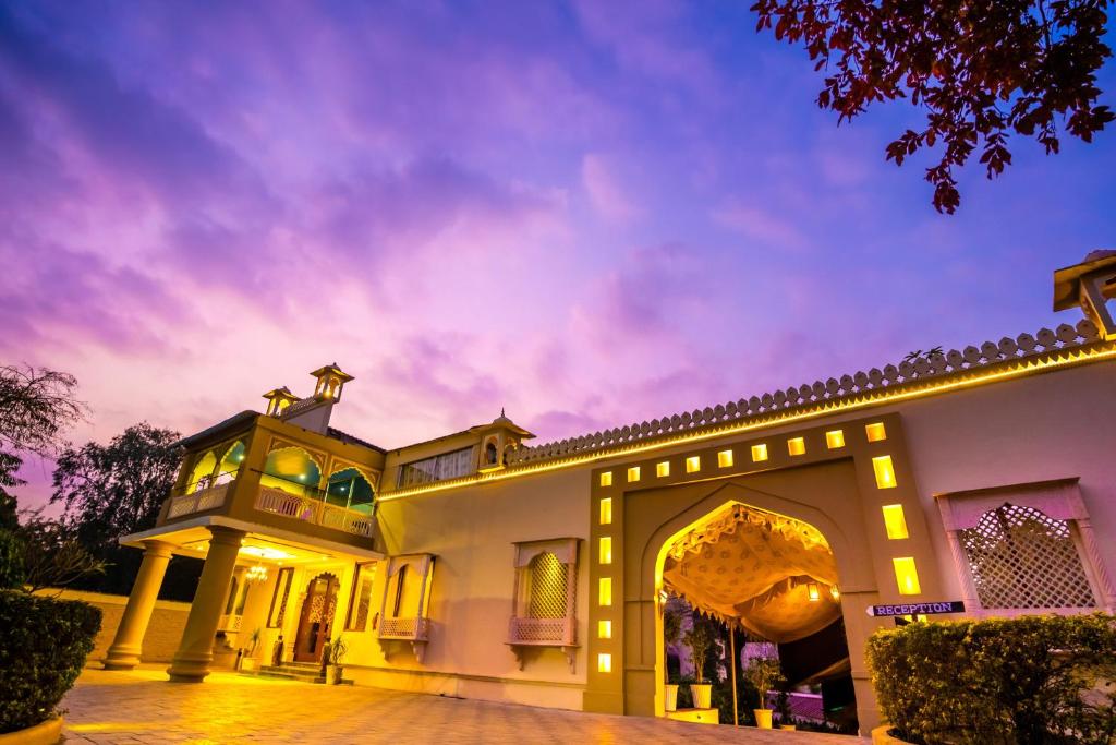 an exterior view of a house at night at Shani Vilas Ranthambore in Sawāi Mādhopur