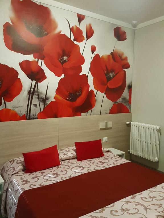Postel nebo postele na pokoji v ubytování Albergo Paradiso