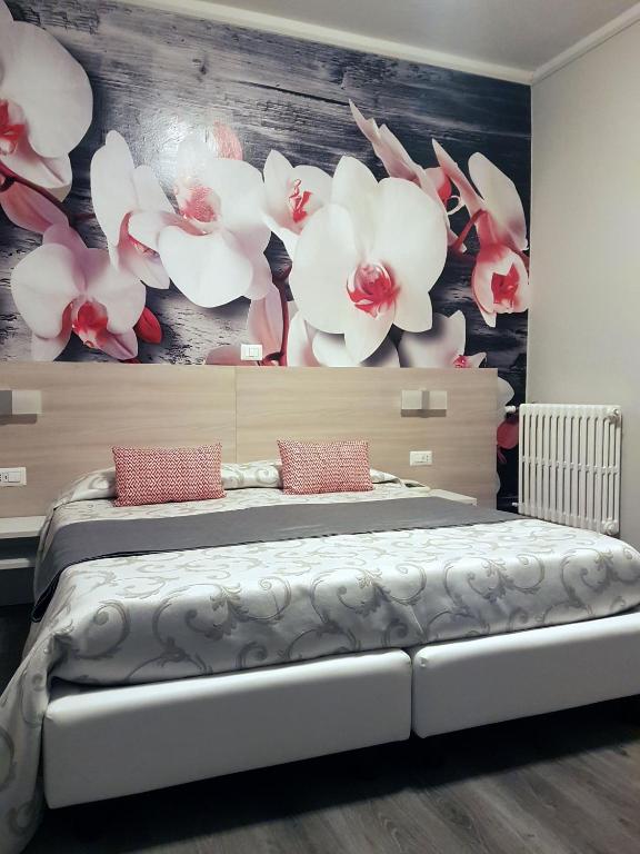 Postel nebo postele na pokoji v ubytování Albergo Paradiso