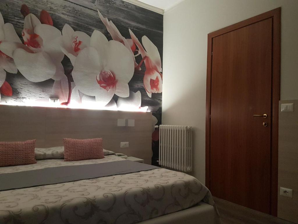 Postel nebo postele na pokoji v ubytování Albergo Paradiso