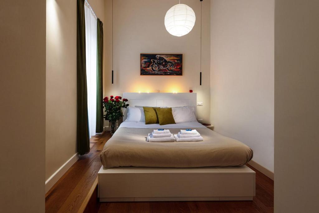 A bed or beds in a room at Tula Inn