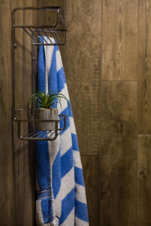 a towel rack with a blue and white towel at Beachlands Hotel in Weston-super-Mare