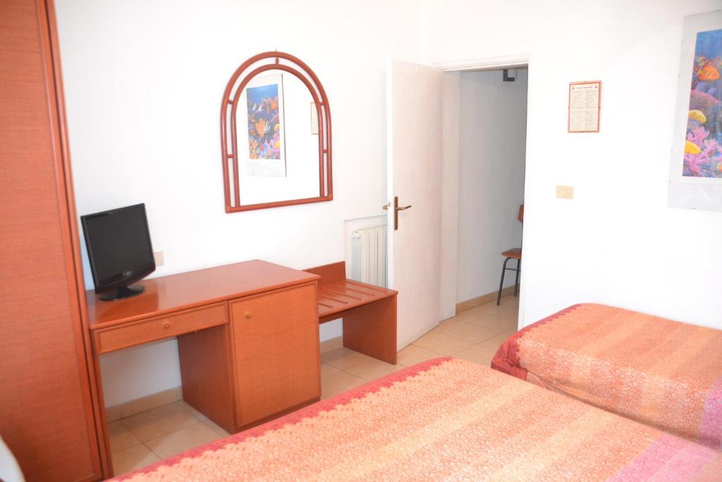 Postel nebo postele na pokoji v ubytování Hotel Scoglio Bianco