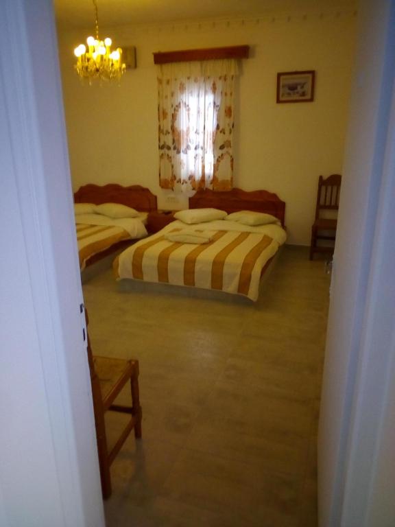 Una cama o camas en una habitación de Hotel Perissa