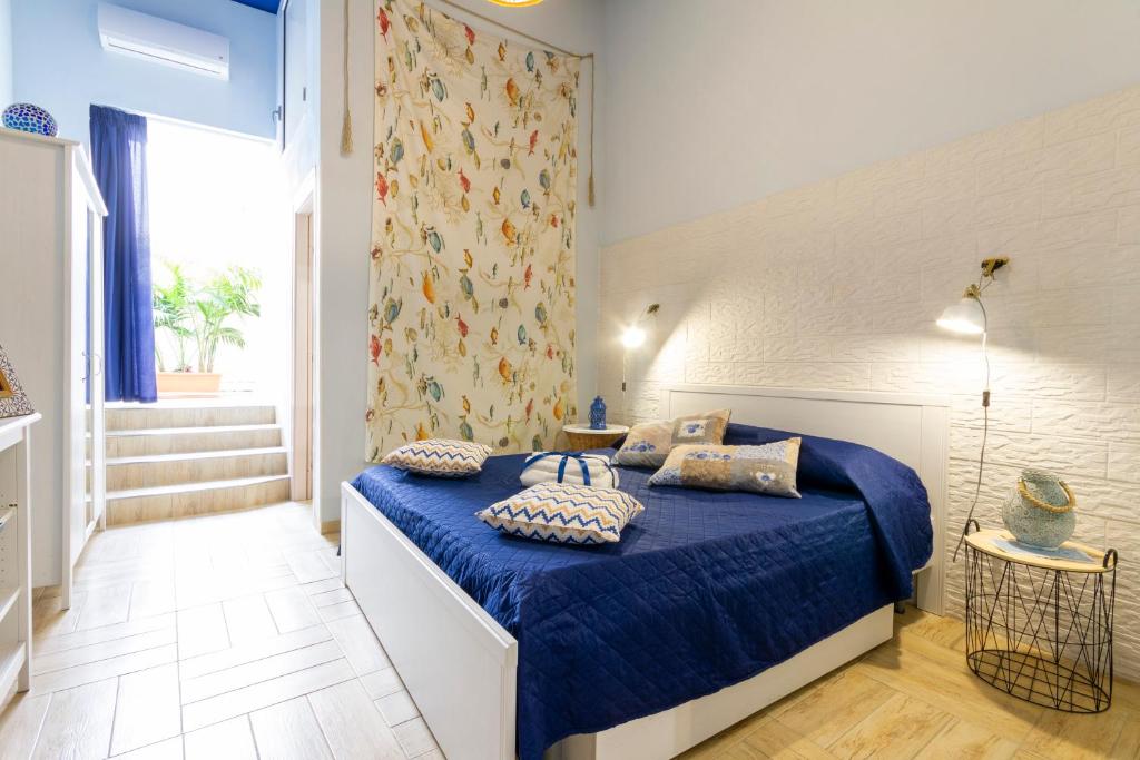 Municipio Apartments tesisinde bir odada yatak veya yataklar