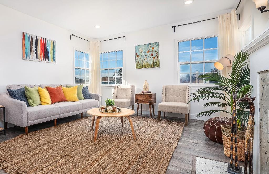 a living room with a couch and a table at LUXE - LA Main&Guest Home - Million Dollar Experience in Los Angeles