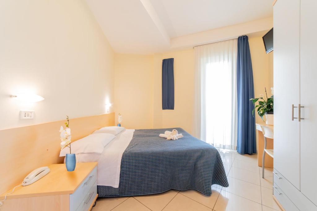 Postel nebo postele na pokoji v ubytování Hotel Fantasy