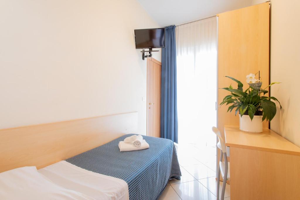 Postel nebo postele na pokoji v ubytování Hotel Fantasy