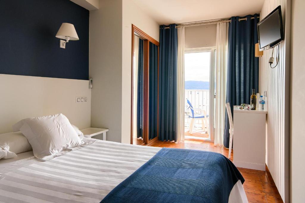 Postel nebo postele na pokoji v ubytování O Son Do Mar