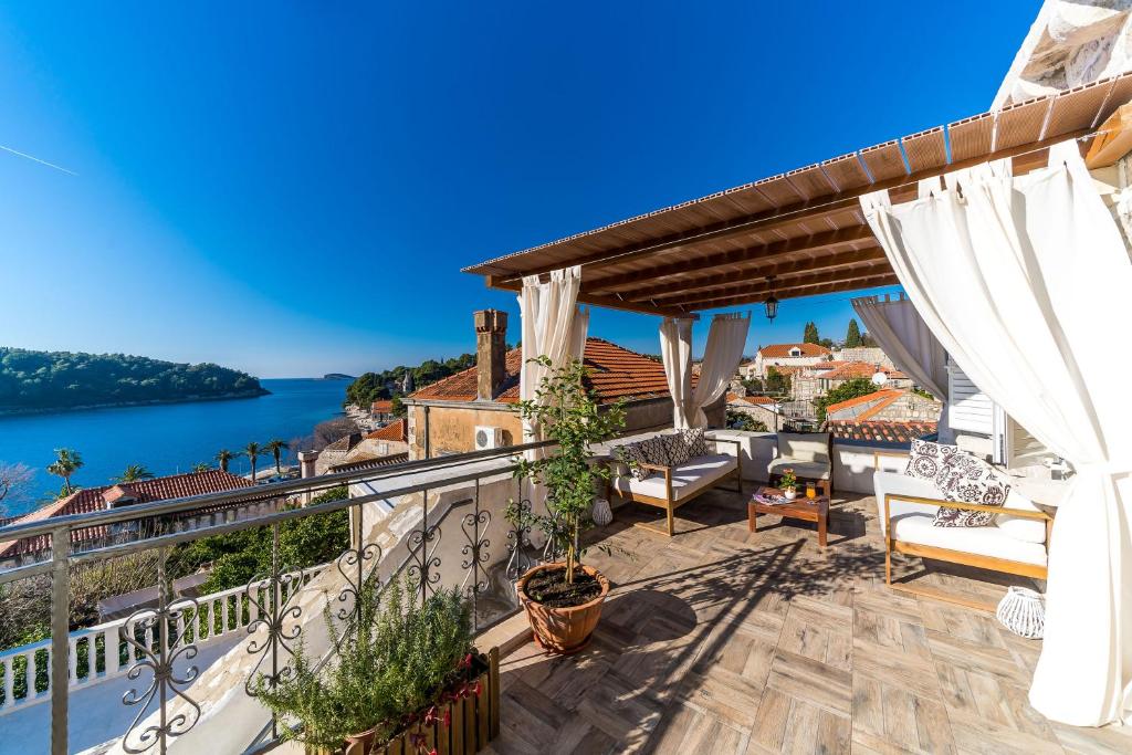 a balcony with a view of the water at Dubrovnik-Cavtat Villa Mima -Sea front Villa with pool in Cavtat