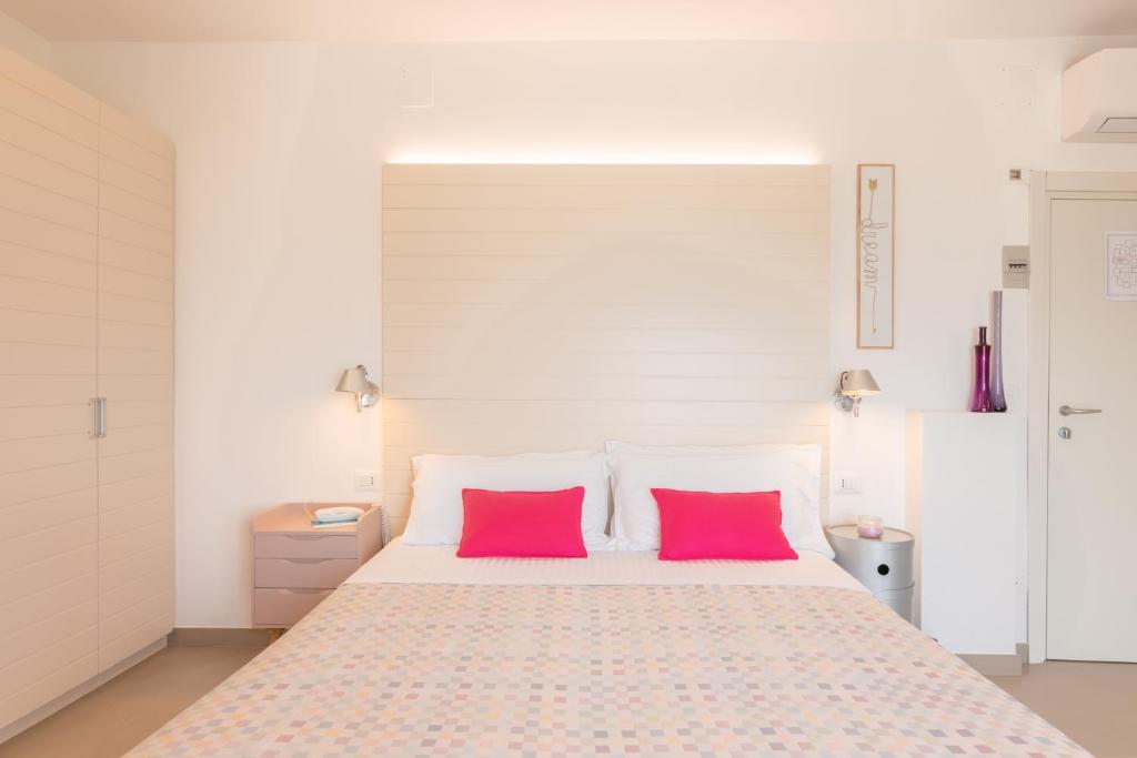 Postel nebo postele na pokoji v ubytování Albergo Punta de l'Est