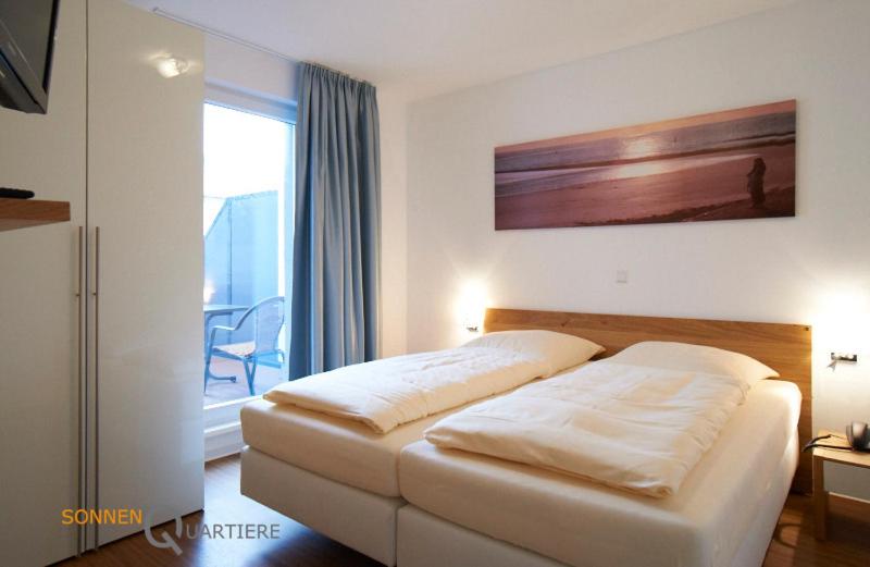 Voodi või voodid majutusasutuse Apartments Boardinghaus Norderney toas