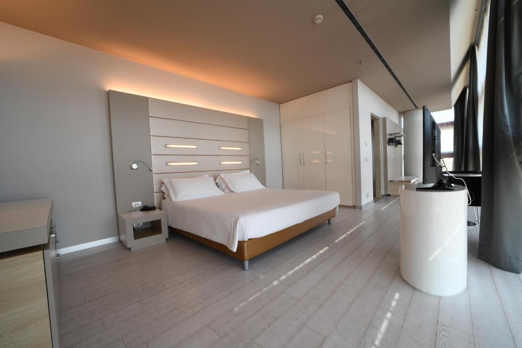 Krevet ili kreveti u jedinici u okviru objekta Best Western Plus Net Tower Hotel Padova