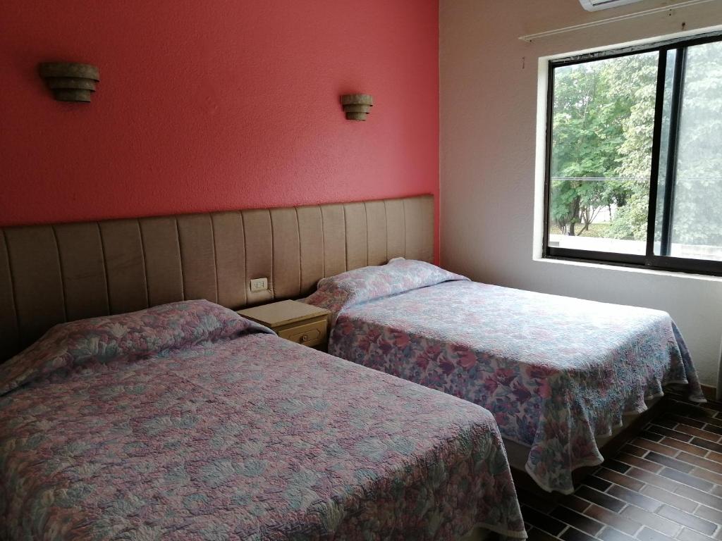 Postel nebo postele na pokoji v ubytování Hotel Tamuin
