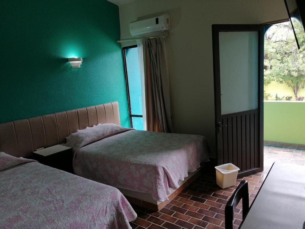 Postel nebo postele na pokoji v ubytování Hotel Tamuin