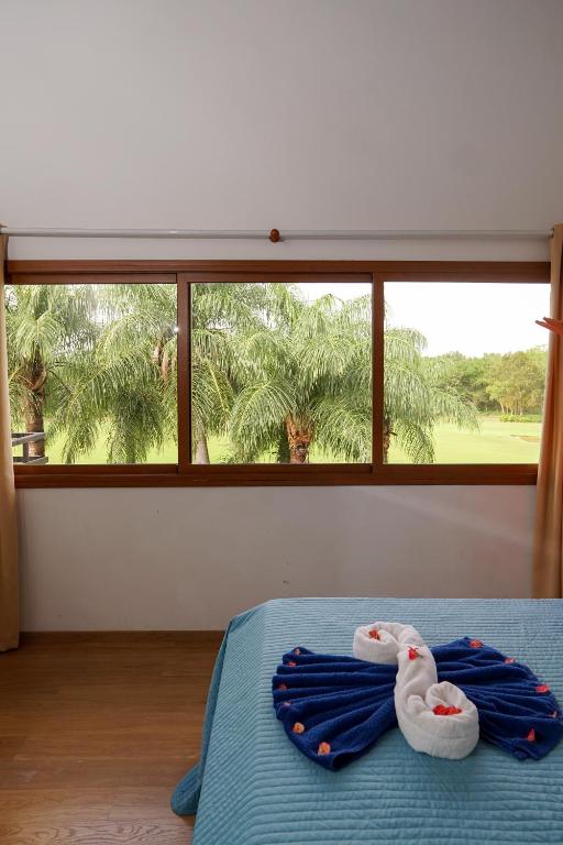 Postel nebo postele na pokoji v ubytování Sybaris Suites & Residences
