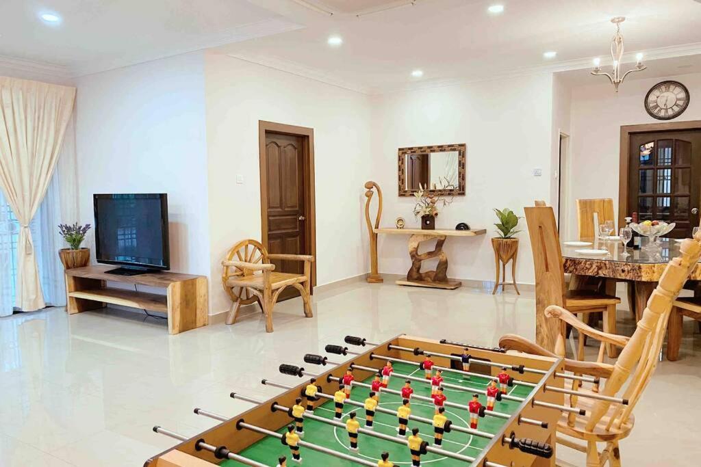 a living room with a foos ball on a table at REBECS 12Pax@TebrauCity/Ikea/Toppen/Aeon in Johor Bahru