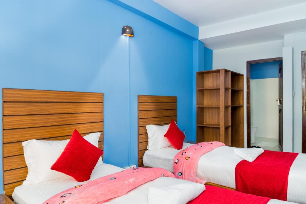 Postel nebo postele na pokoji v ubytování Hotel Nepal Bhumi