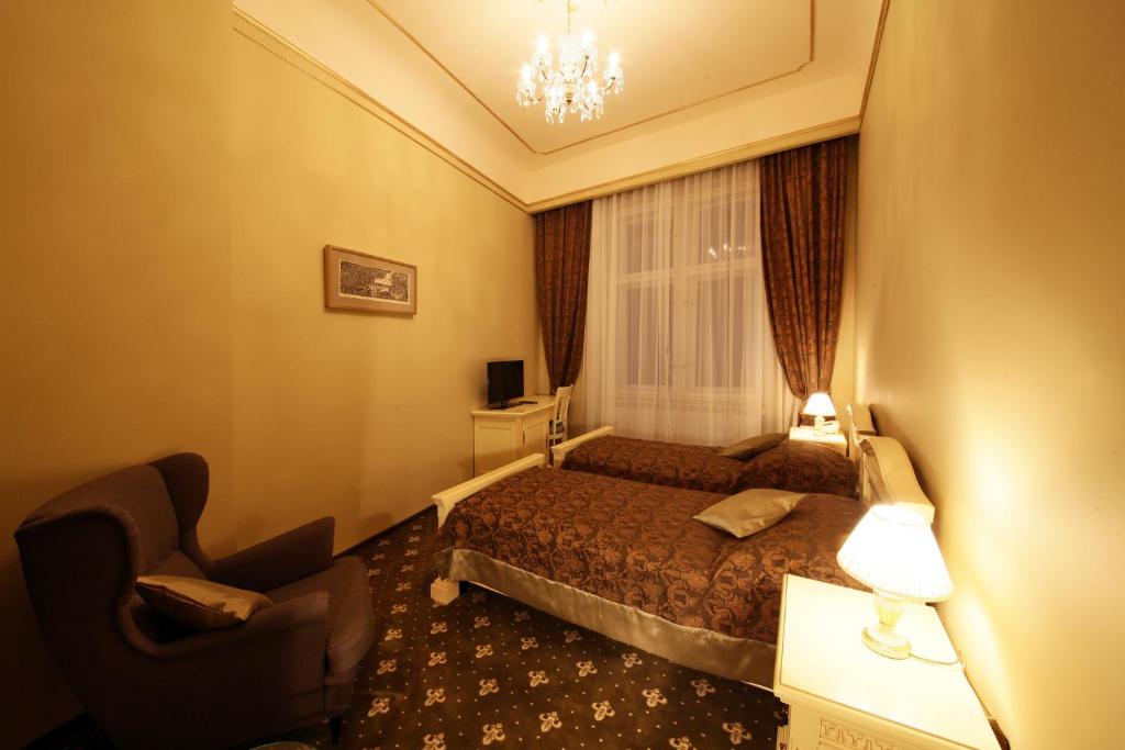 Postel nebo postele na pokoji v ubytování Alisa Hotel