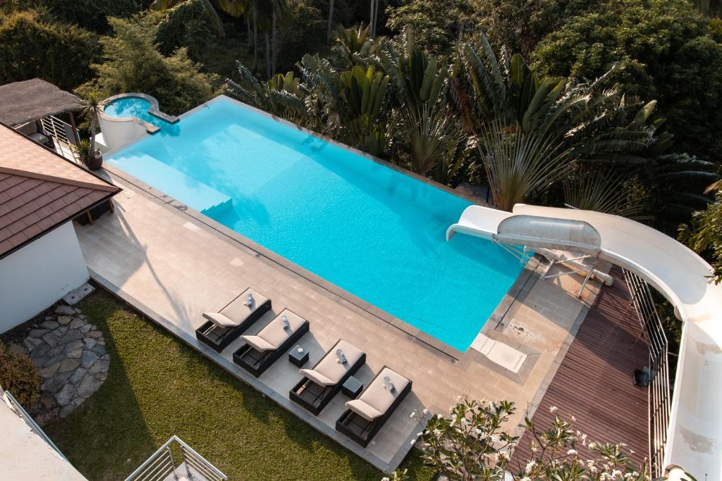 an overhead view of a swimming pool with lounge chairs next to it at Villa Lulu Koh Samui in Mae Nam