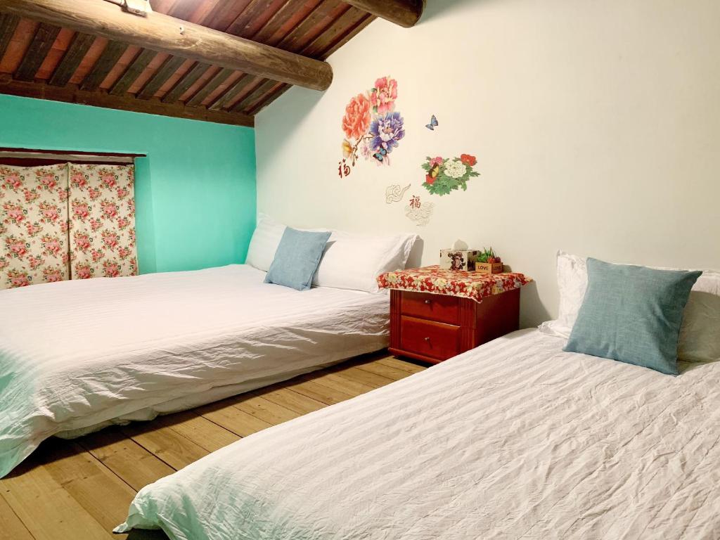 Postel nebo postele na pokoji v ubytování XQ B&B