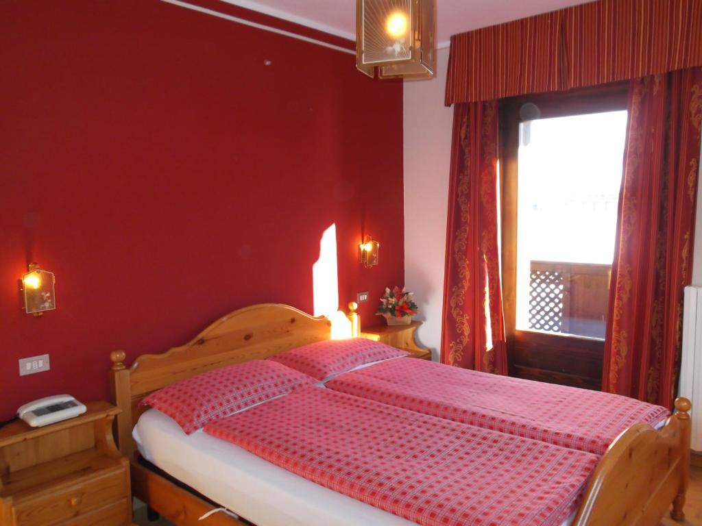 Postel nebo postele na pokoji v ubytování Hotel Adele