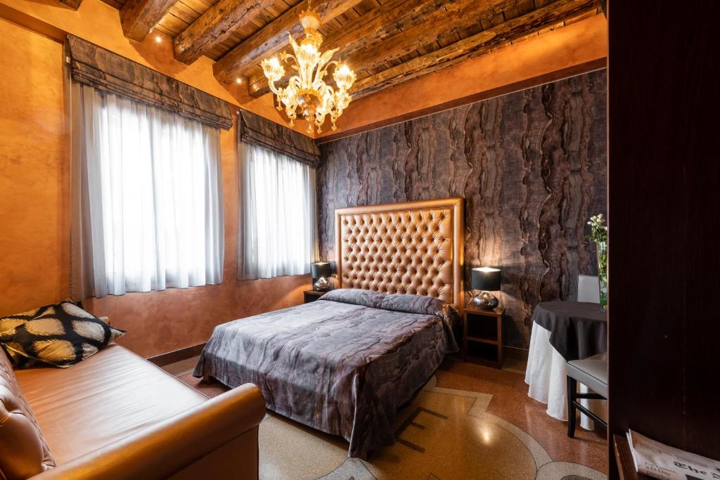 Postel nebo postele na pokoji v ubytování Hotel Abbazia