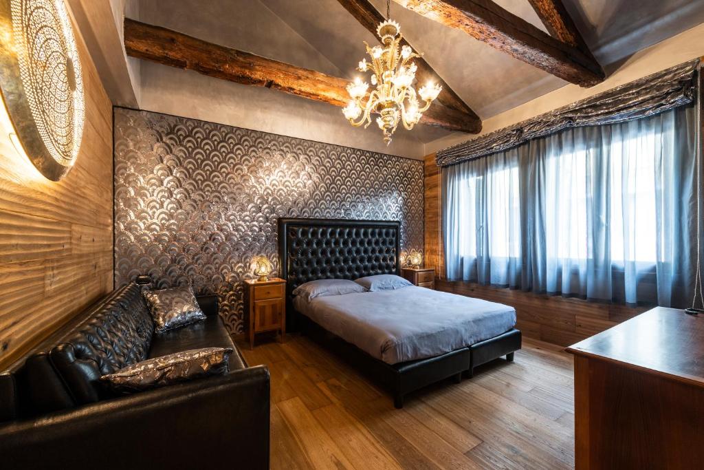 Postel nebo postele na pokoji v ubytování Hotel Abbazia