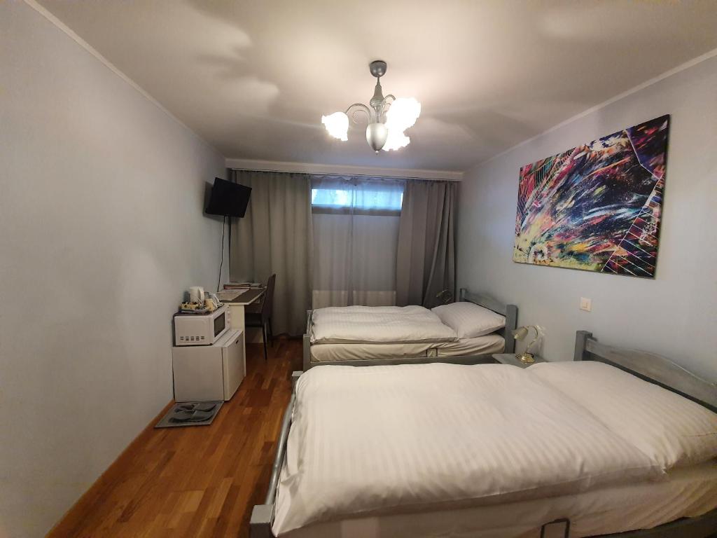 Postel nebo postele na pokoji v ubytování Le Merle Châtelain