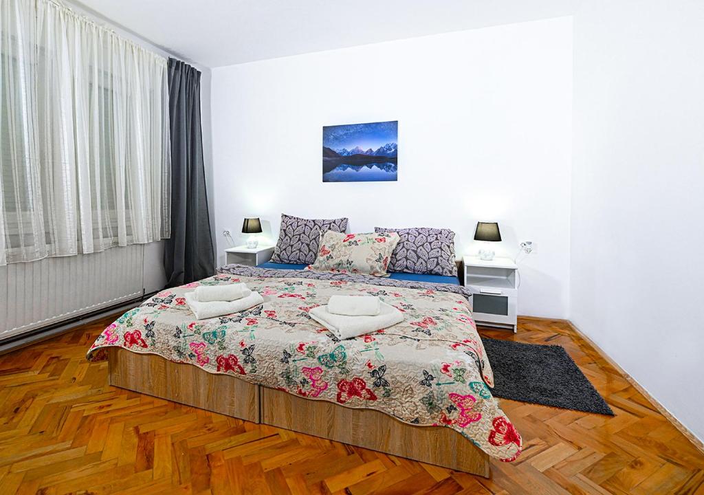 a bedroom with a bed with two pillows on it at Zagreb Apartmani Santana in Zagreb