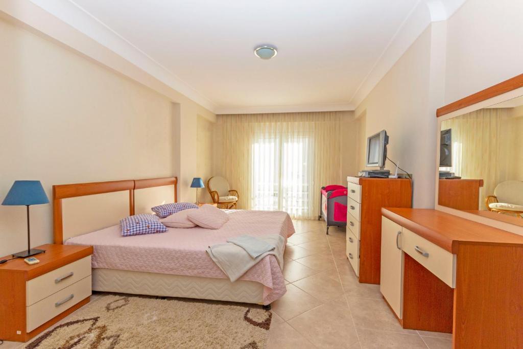 Postel nebo postele na pokoji v ubytování Paradise Town Villa Royal