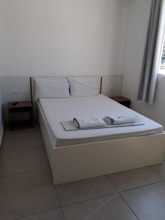 Postel nebo postele na pokoji v ubytování Hotel Lisboa