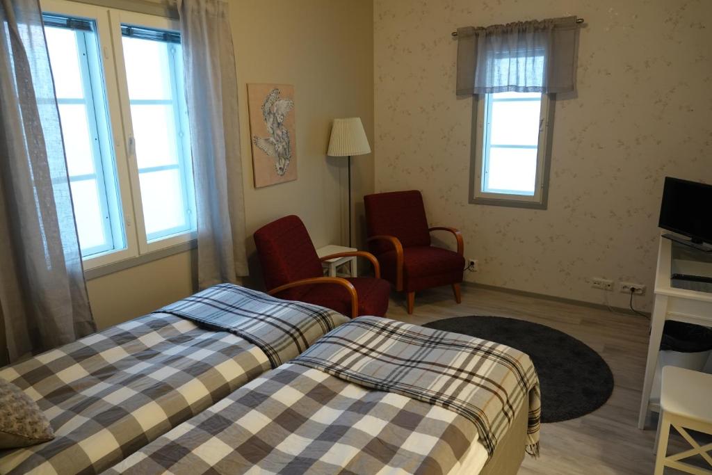 Postel nebo postele na pokoji v ubytování Kierinki Village Majatalo