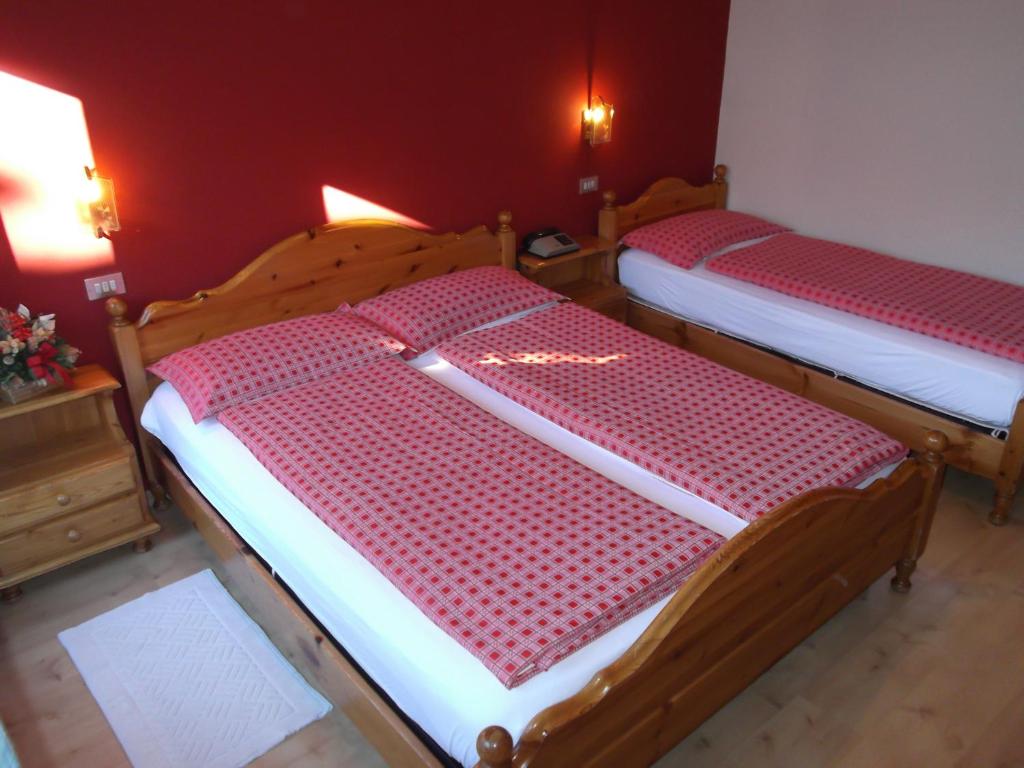 Postel nebo postele na pokoji v ubytování Hotel Adele