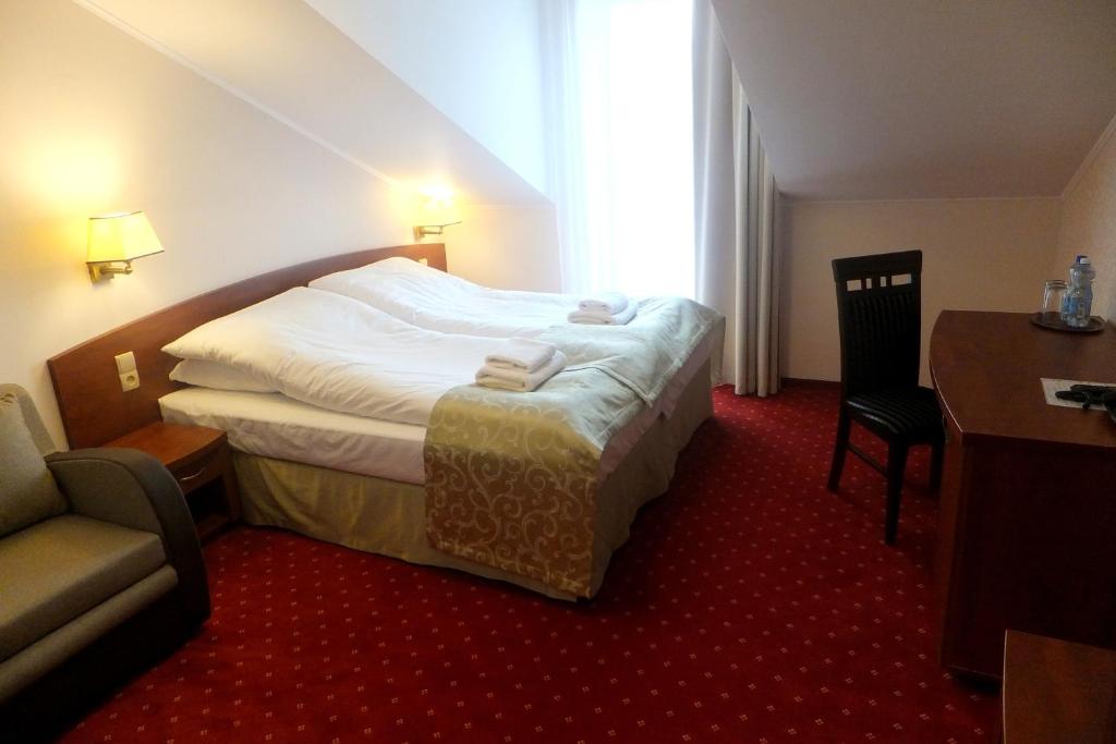 Posteľ alebo postele v izbe v ubytovaní Hotel Stara Gorzelnia