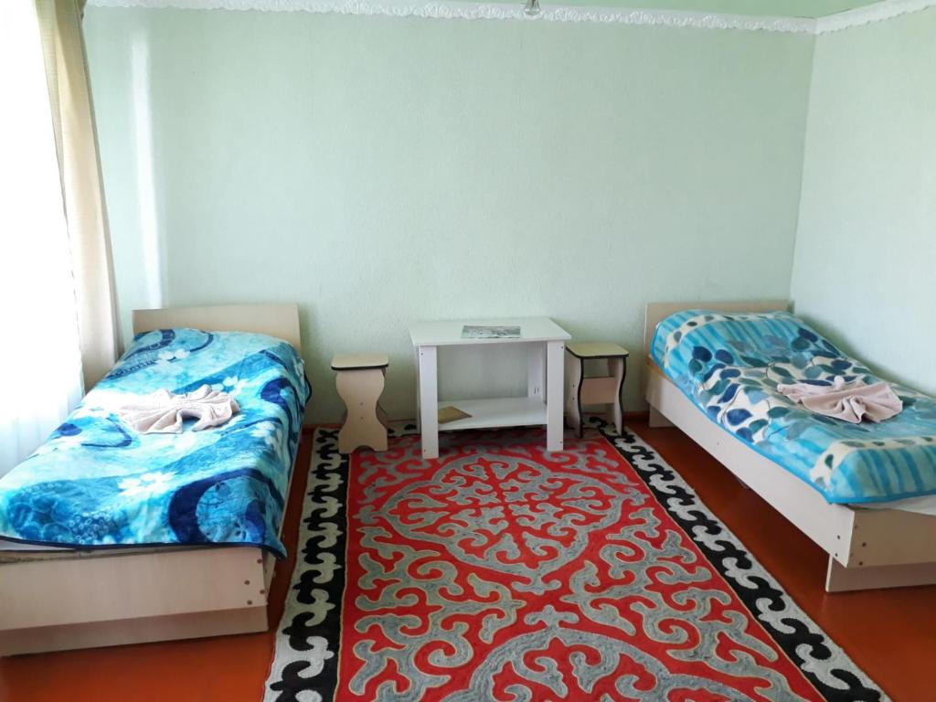 Postel nebo postele na pokoji v ubytování Guest House Jekshen