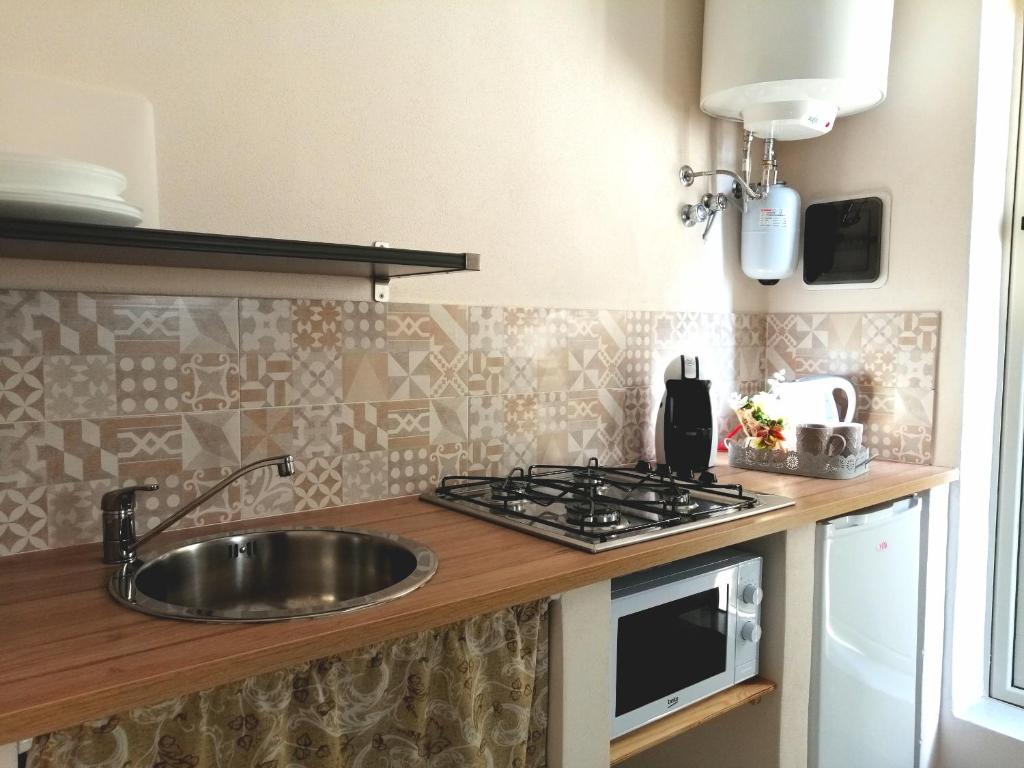 Kuchyň nebo kuchyňský kout v ubytování DUCEZIO rooms