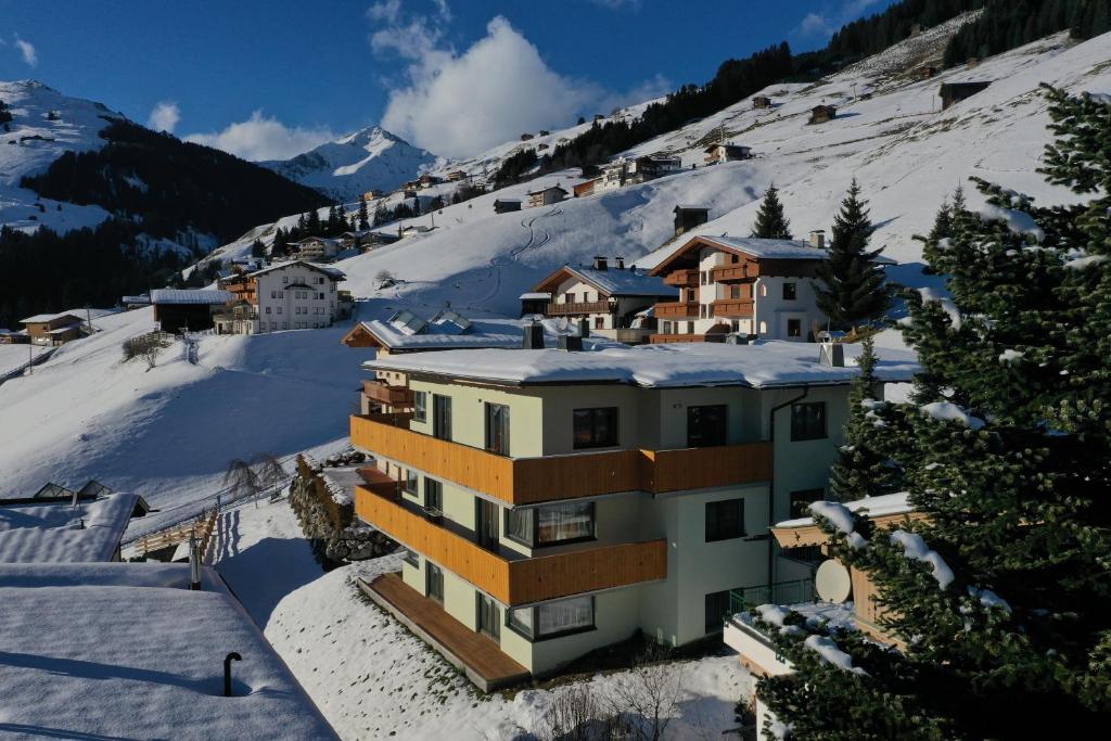 a building in the snow on a mountain at Amalia Haus in Tux