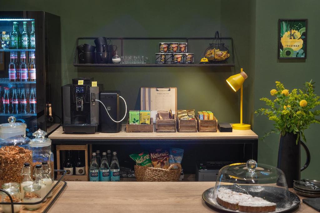 a counter with a coffee maker on a table at Konrads Limburg - Hotel &amp; Gästehaus in Limburg an der Lahn