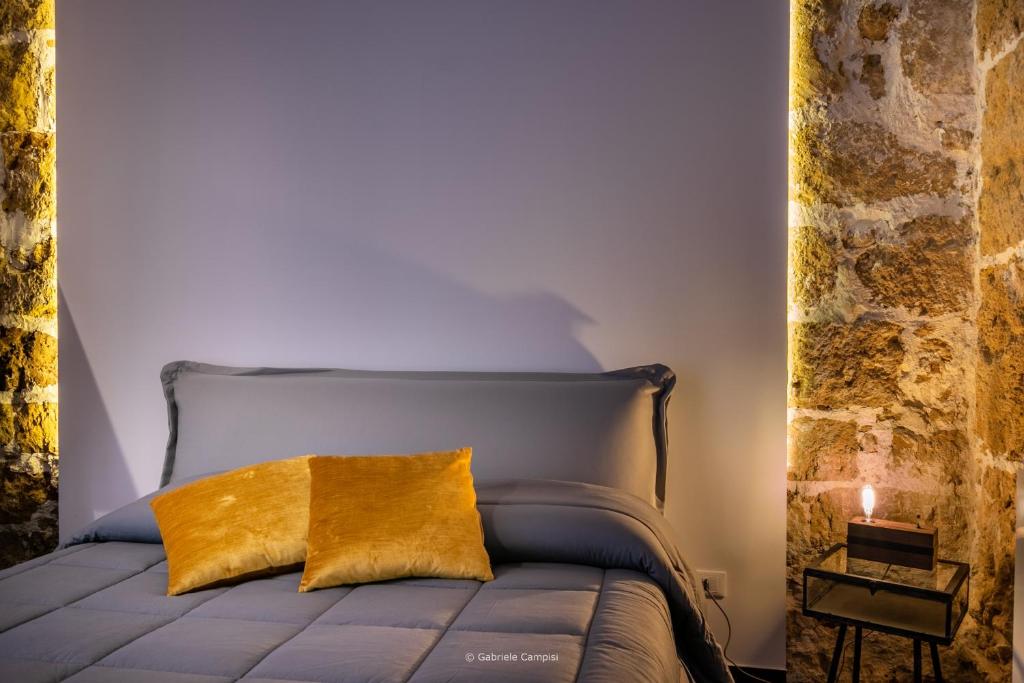 Postel nebo postele na pokoji v ubytování GARIBALDI MAISON DE CHARME