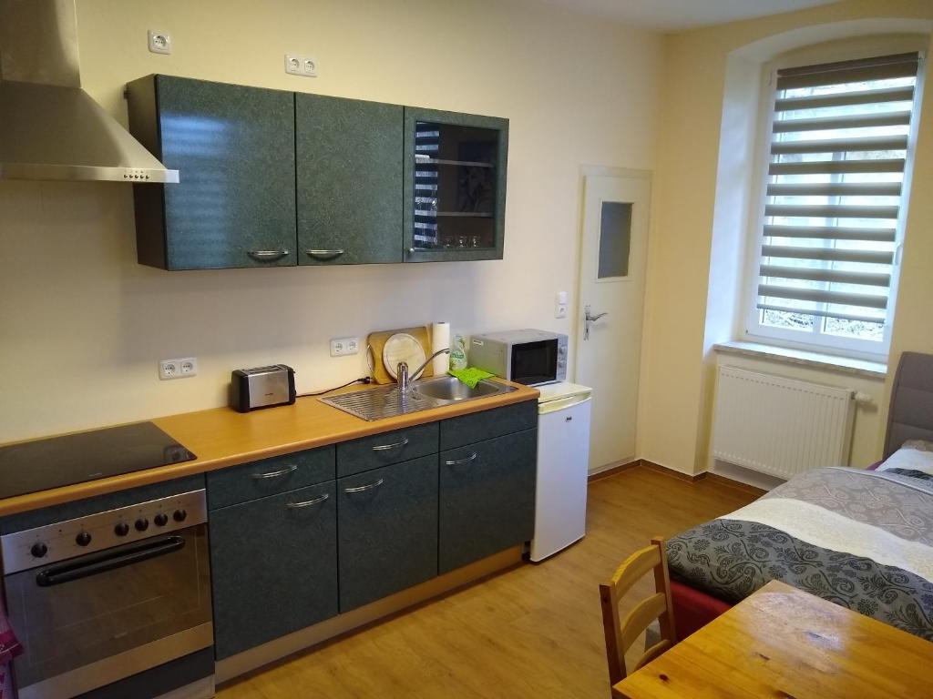Kuchyň nebo kuchyňský kout v ubytování Ferienwohnung Schleich