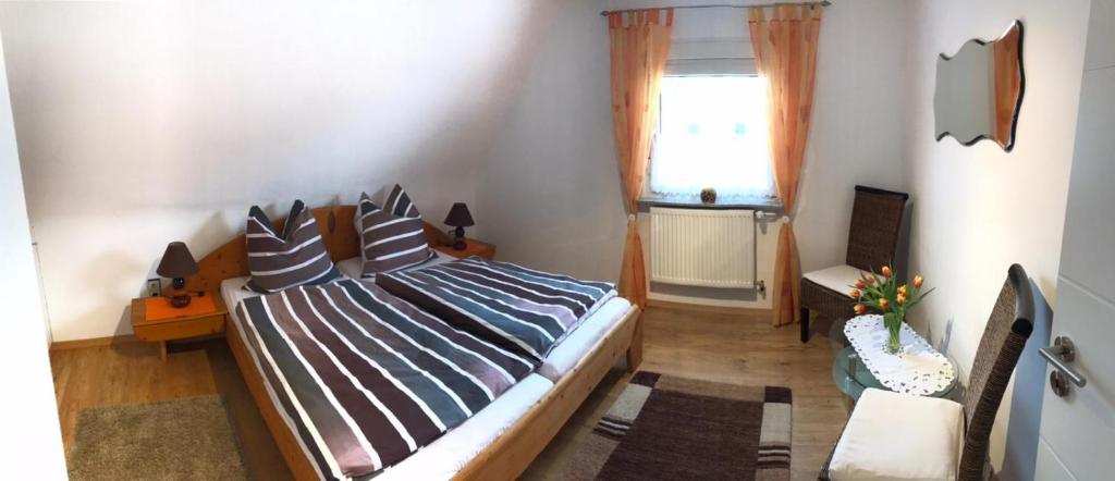 Postel nebo postele na pokoji v ubytování Ferienhaus Hedwig