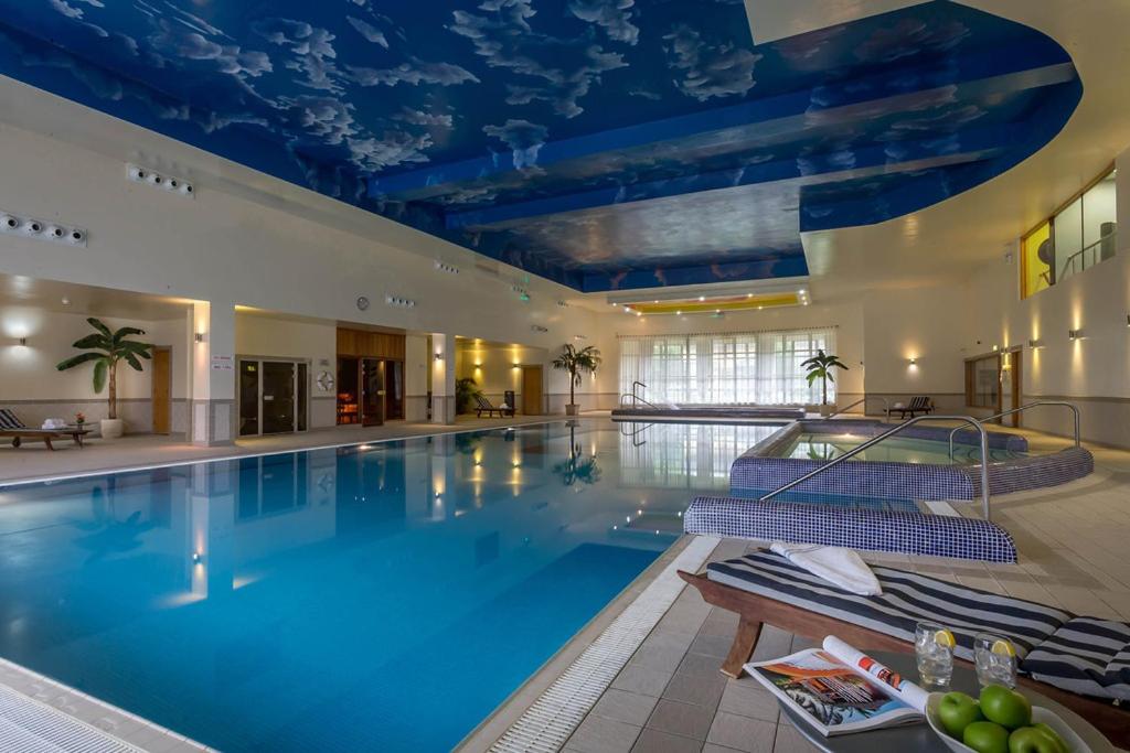 a large swimming pool with a blue ceiling at Mullingar Park Hotel in Mullingar