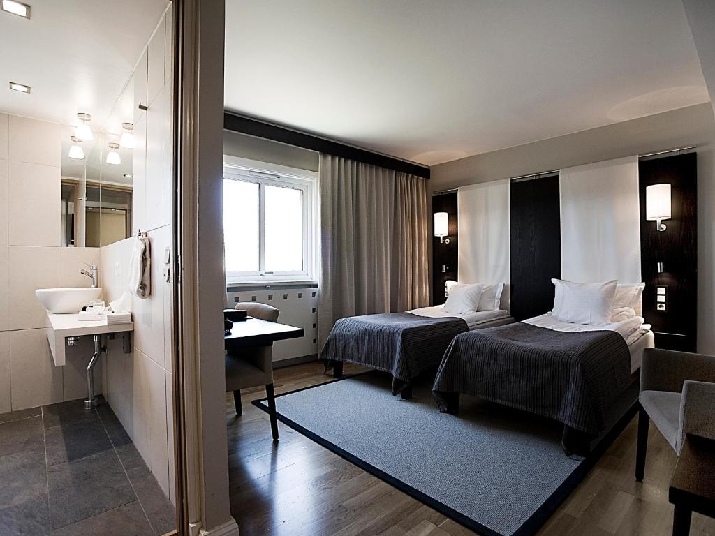 Ένα ή περισσότερα κρεβάτια σε δωμάτιο στο Hotel Tylösand